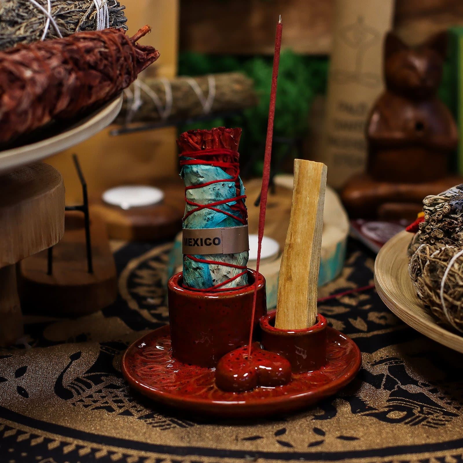 Glossy red ceramic Palo Santo and smudge holder with a heart-shaped dish