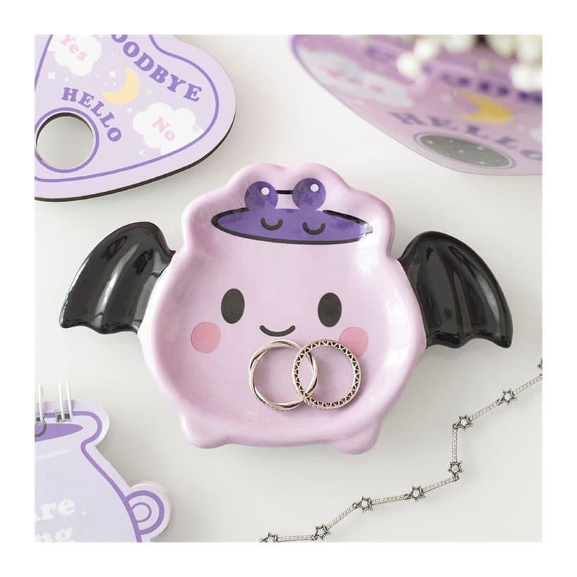Ceramic cauldron trinket dish with bat wings and a smiling pastel face
