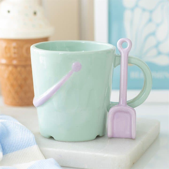 Pastel bucket mug with a spade spoon