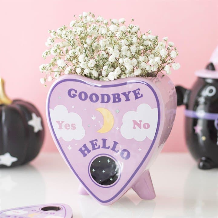 Pastel planchette flower vase with a talking board design and celestial details