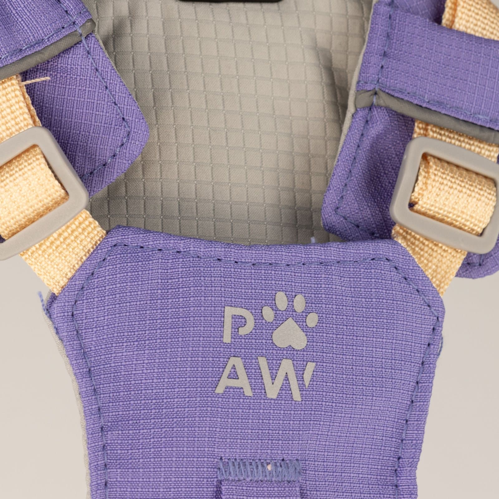 Lavender step-in dog harness with reflective mesh and an amethyst paw charm