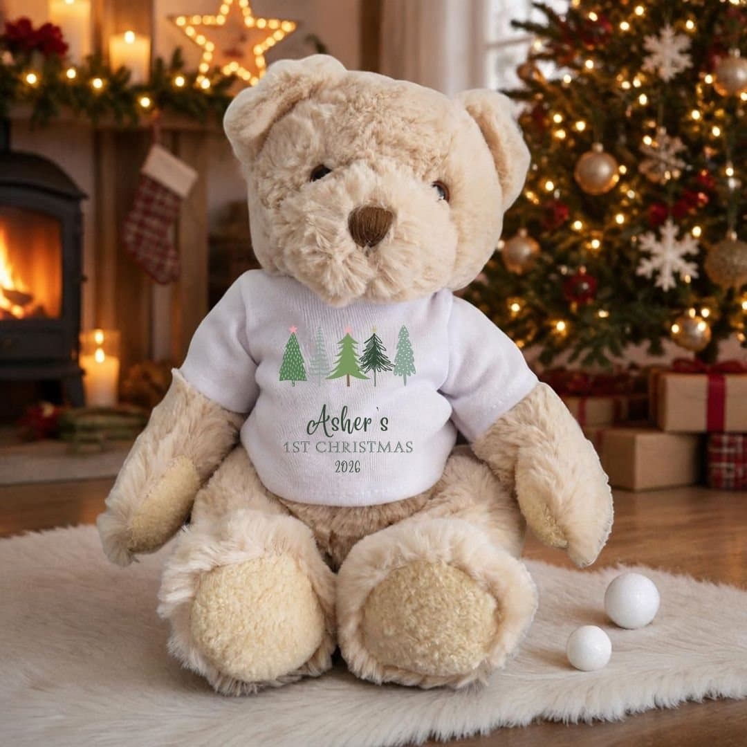 Personalised 1st Christmas teddy bear in a T-shirt with a row of fir trees