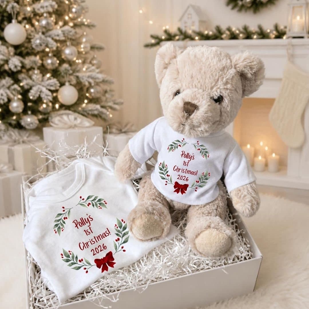 Personalised baby gift box with a teddy and a vest showing a red bow and holly design