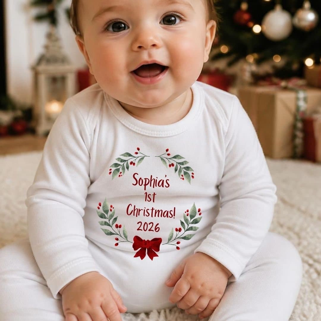 Personalised baby vest or grow with green holly, berries and a red bow design