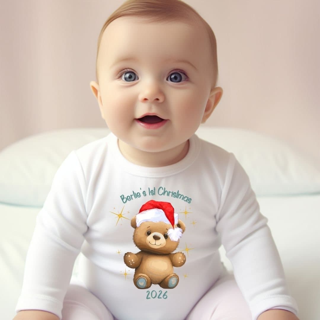 Baby vest with a First Christmas teddy design and a personalised name