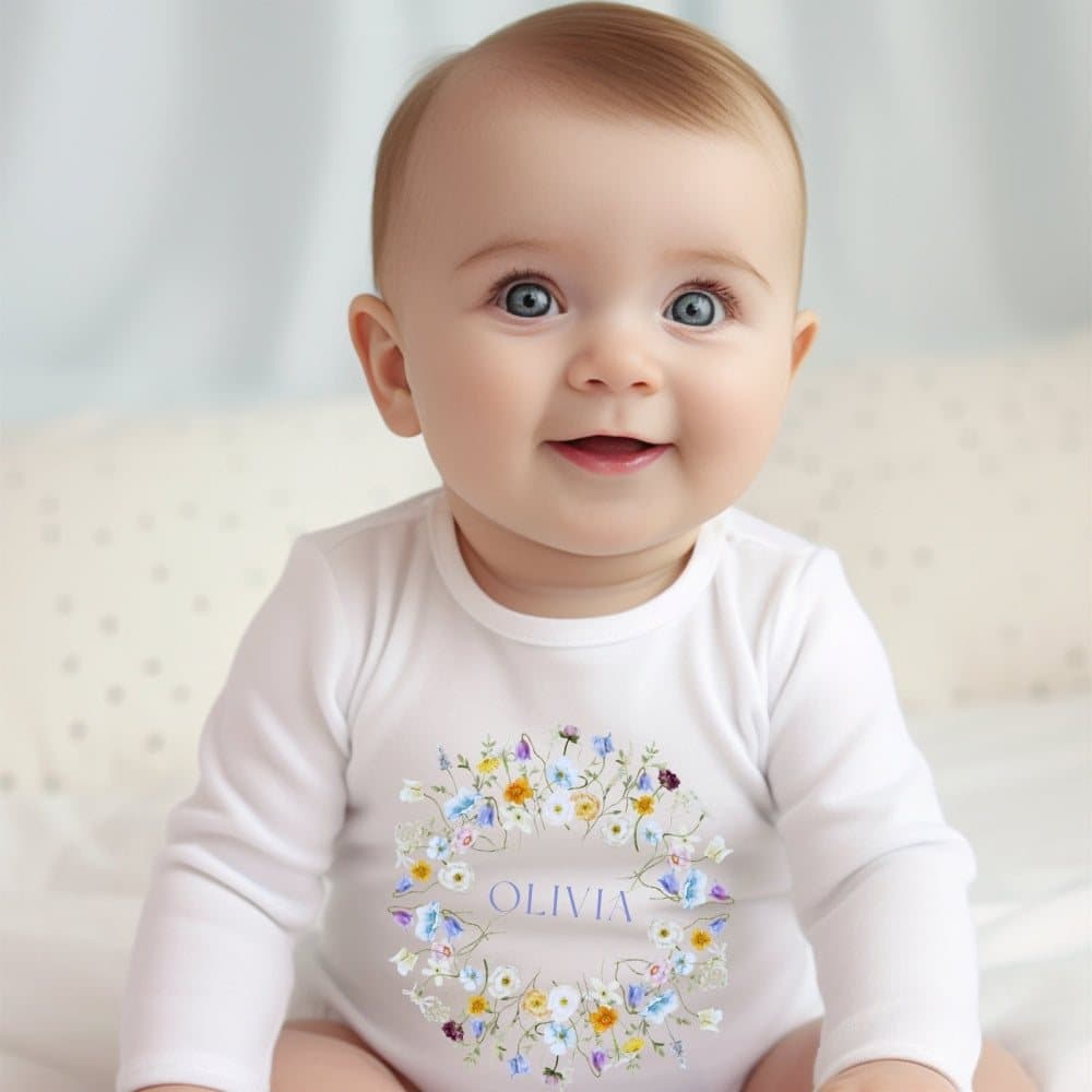 Personalised baby girl spring flowers outfit with a name, as a bib, vest or babygrow