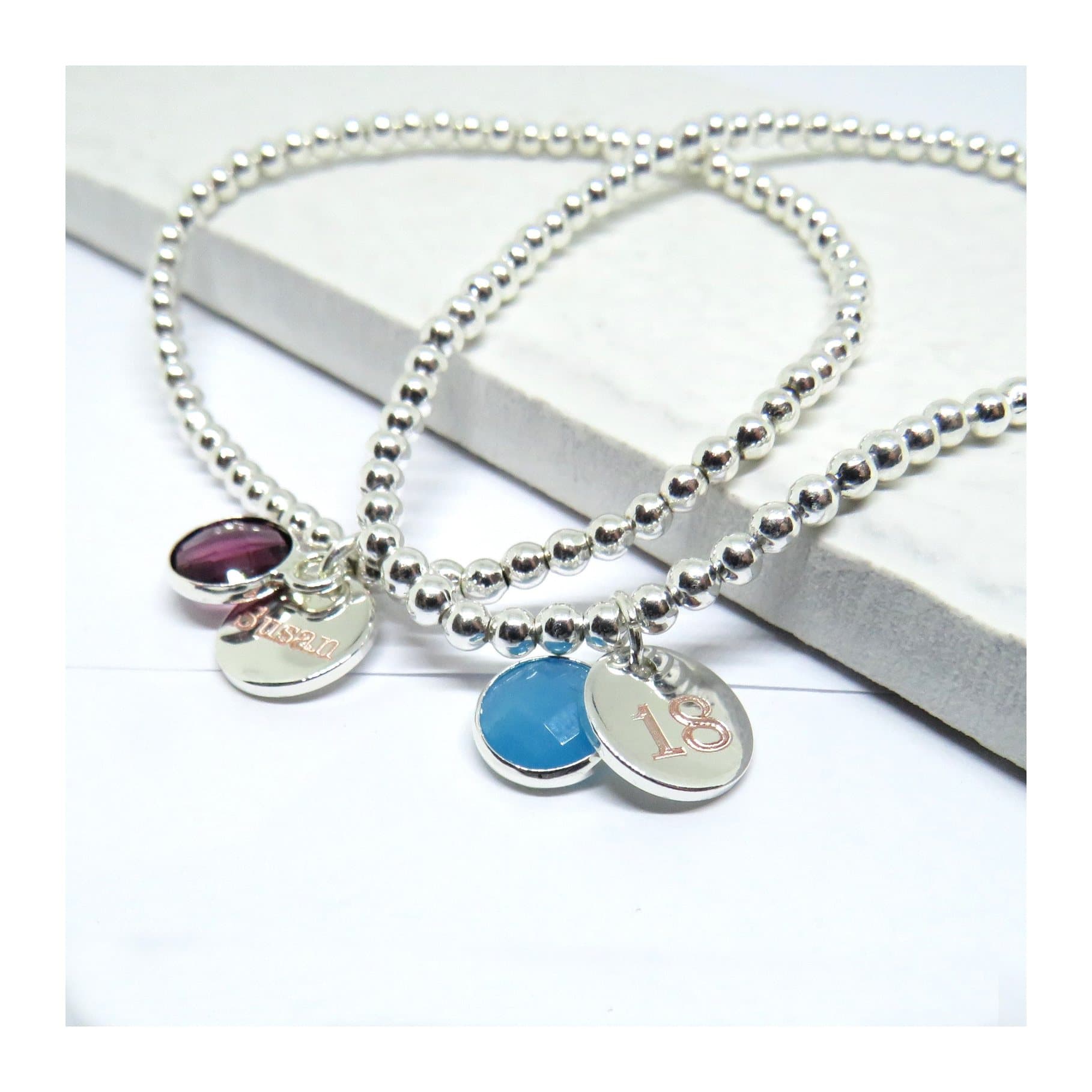 Silver beaded stretch bracelet with a coloured birthstone charm