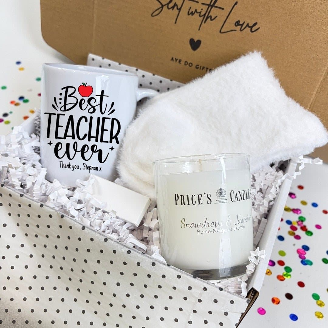 Best Teacher Ever mug, scented candle, fluffy socks and matches in a hamper