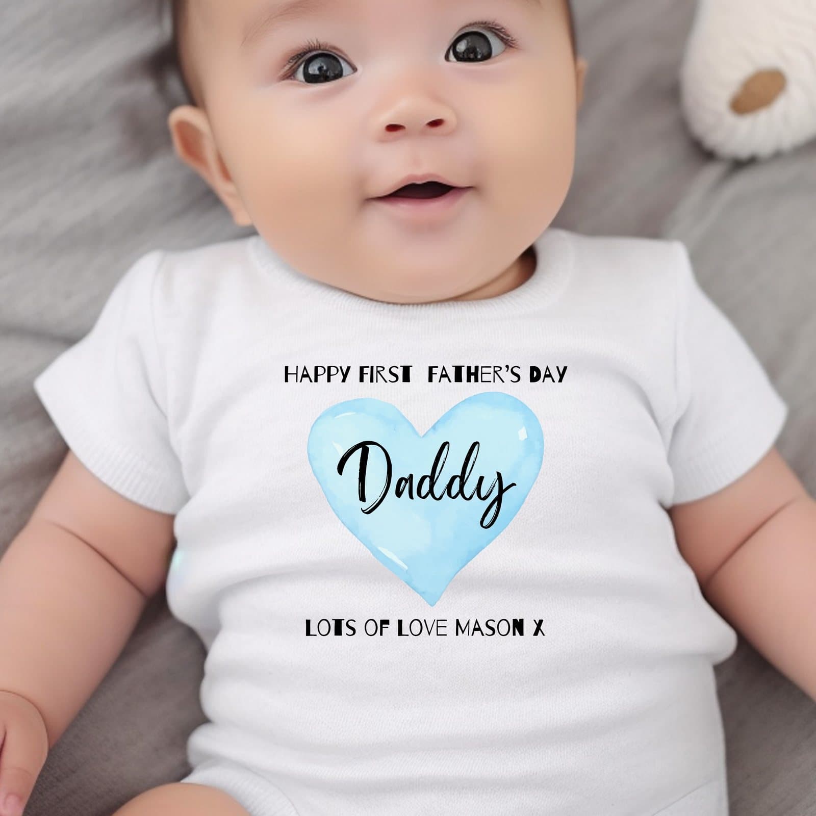 Baby clothing with a blue heart Happy First Fathers Day design