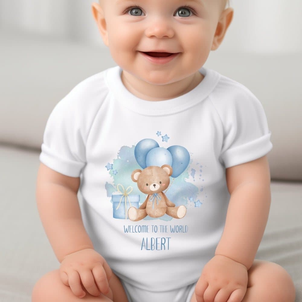 Personalised baby grow with a blue Welcome to the World teddy and balloons design
