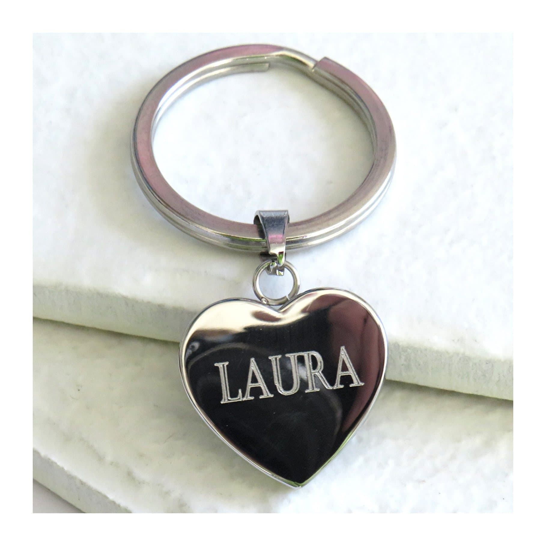 Heart-shaped keyring with a name engraved on it.