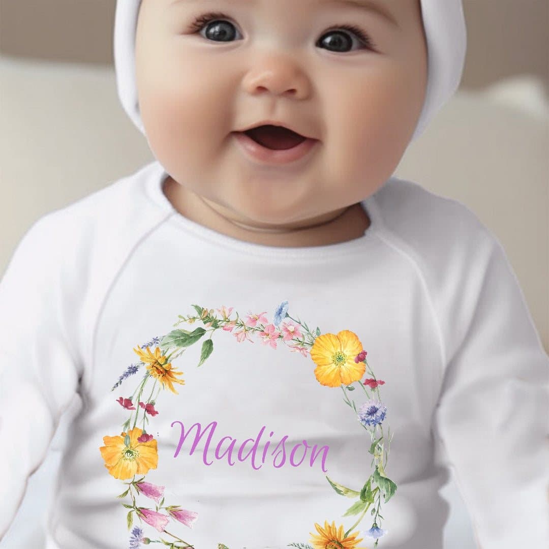 Colourful flowers baby grow, vest or bib with a personalised name