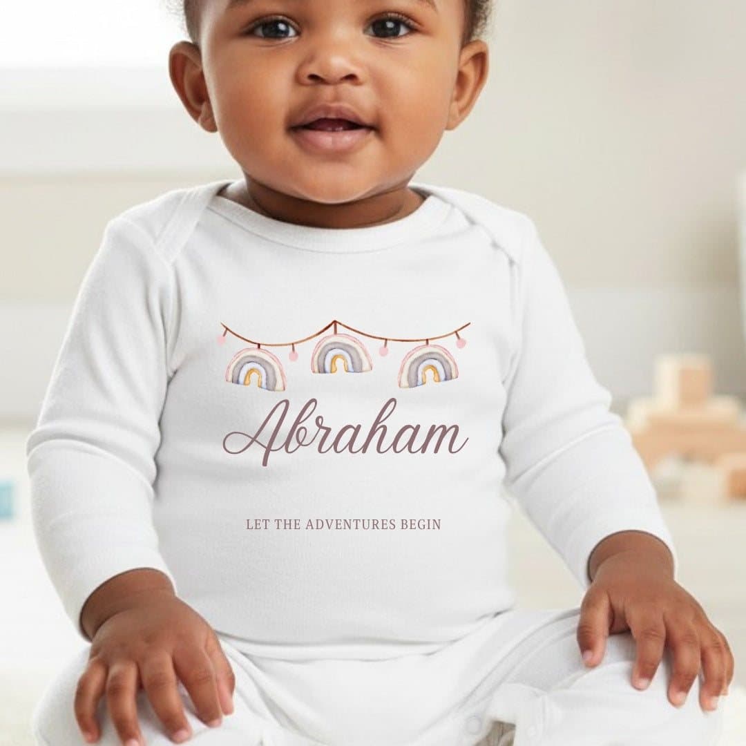Personalised rainbow bunting baby grow with a name, in a rainbow design