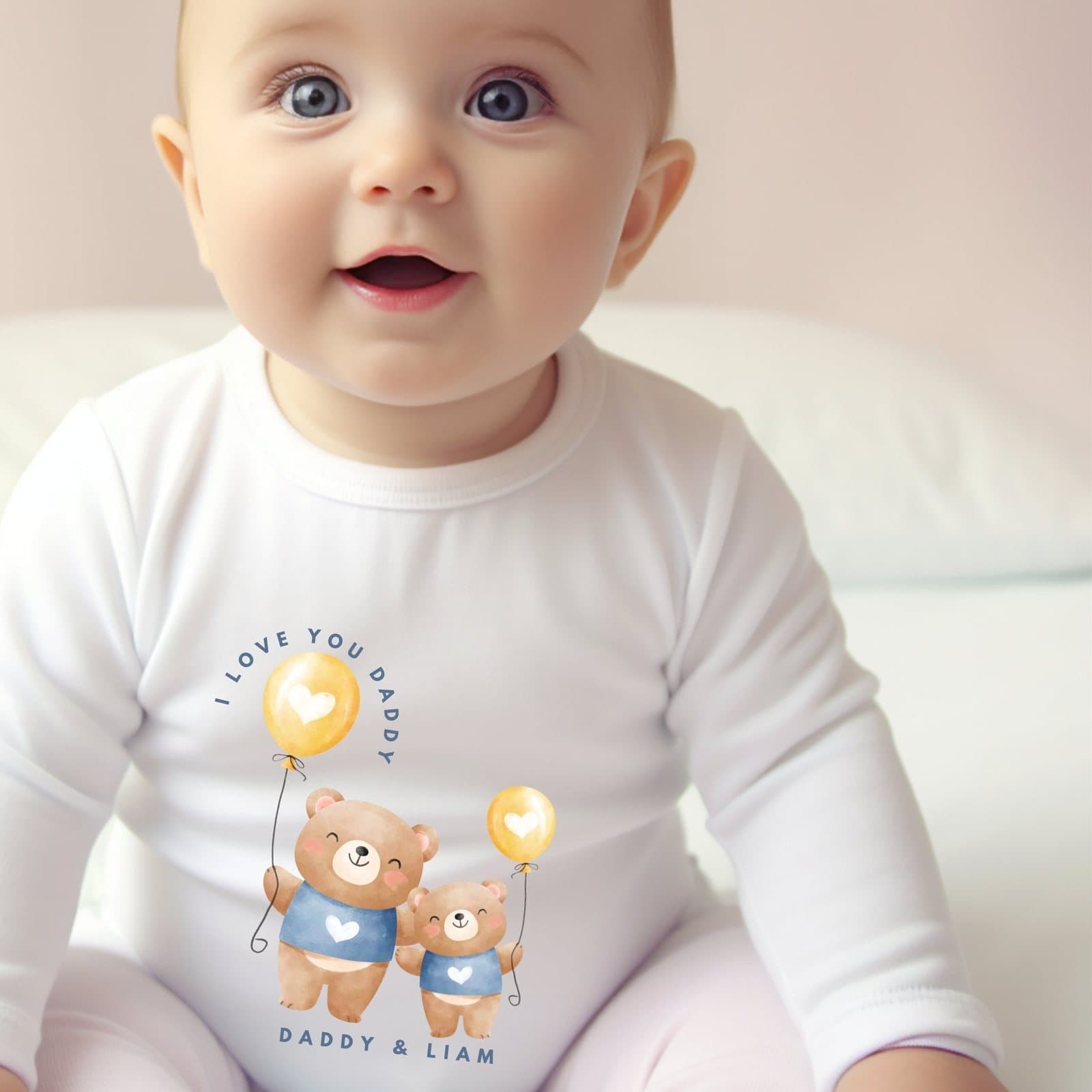 Personalised baby grow with a Daddy and baby bear holding balloons