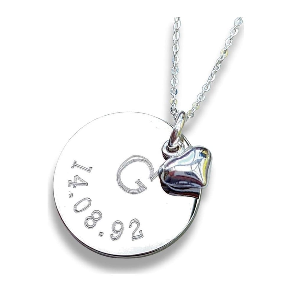 Personalised date and letter necklace with a round silver disc and mini heart charm