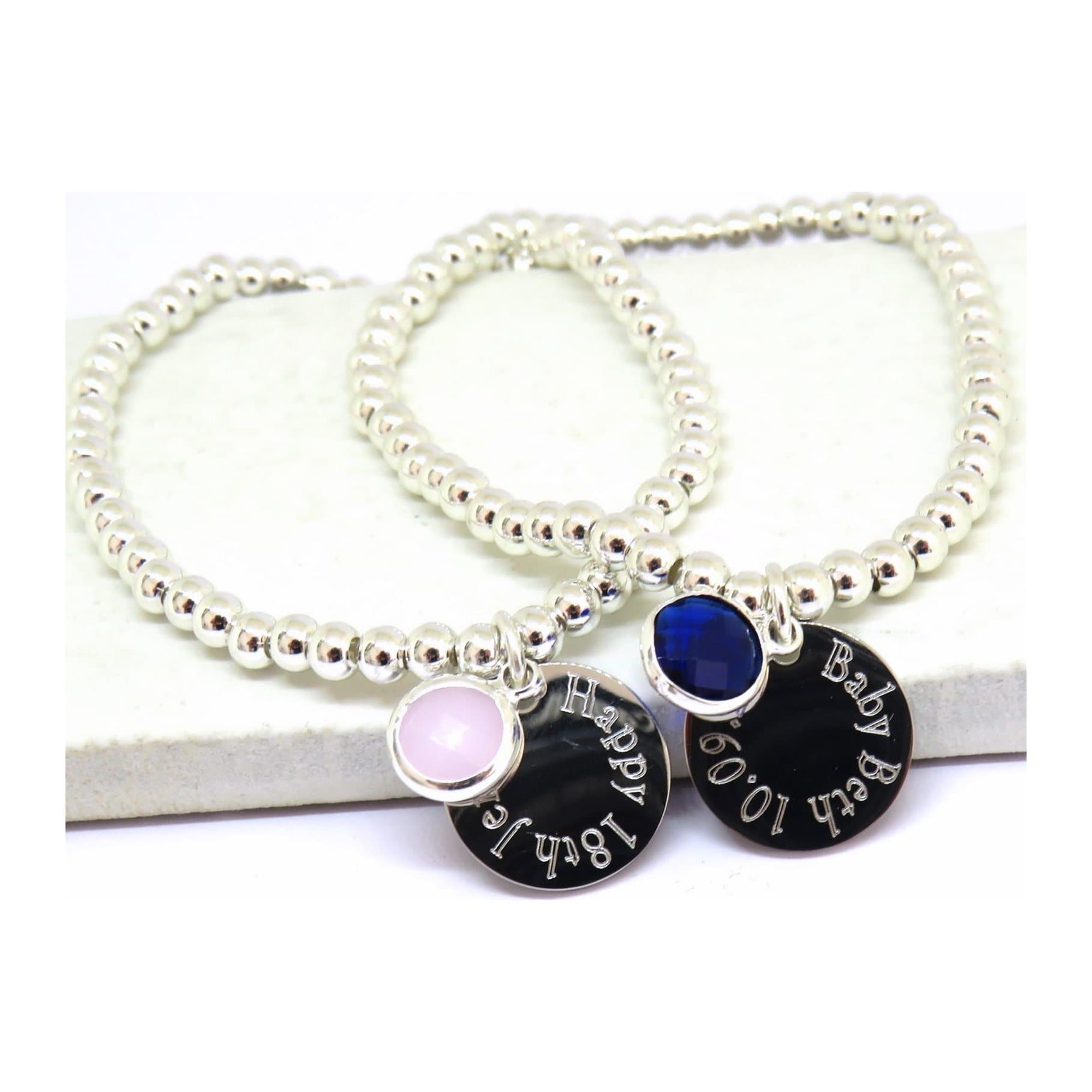 Personalised birthstone bracelet with an engraved silver charm and coloured birthstone