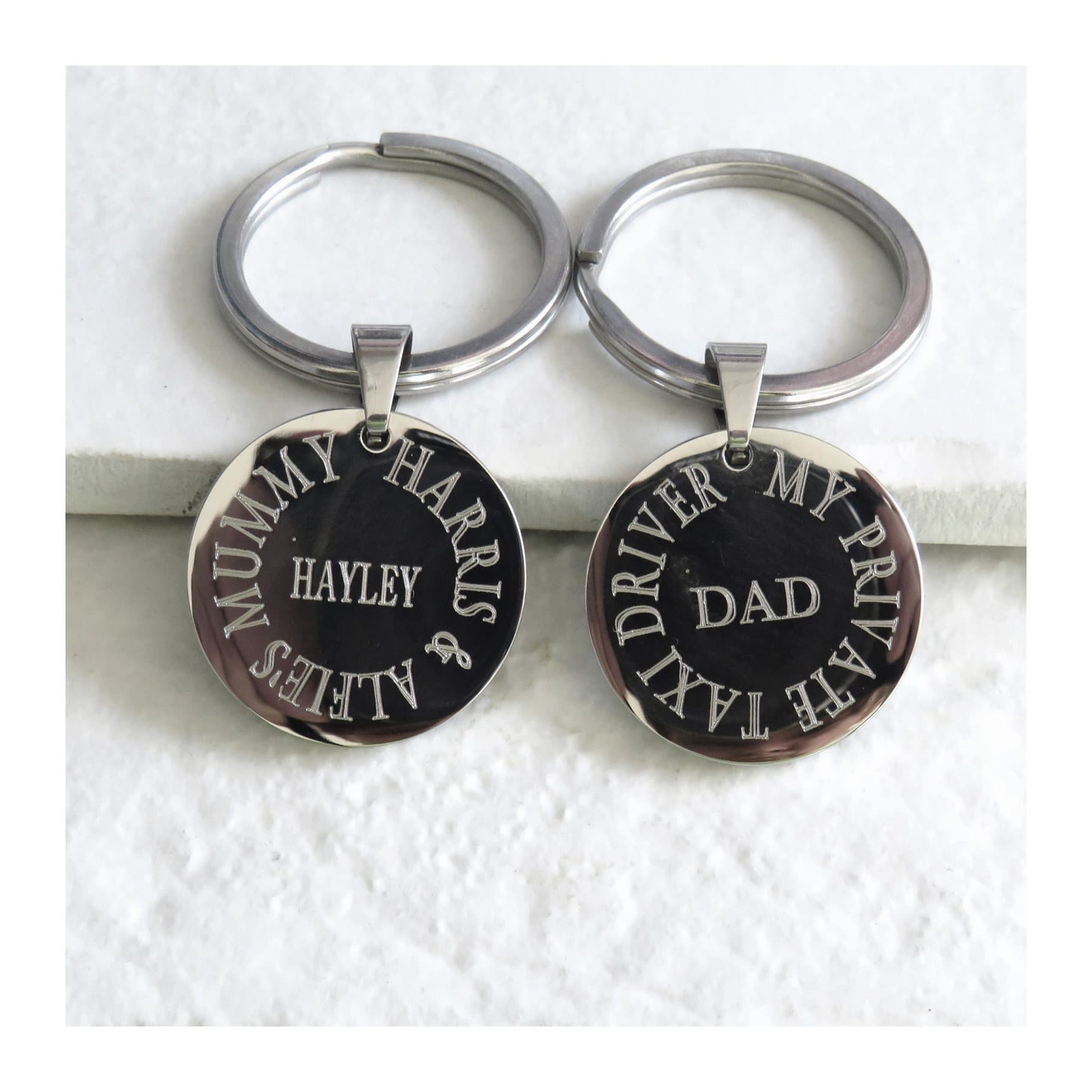 Personalised round stainless steel keyring with an engraved message