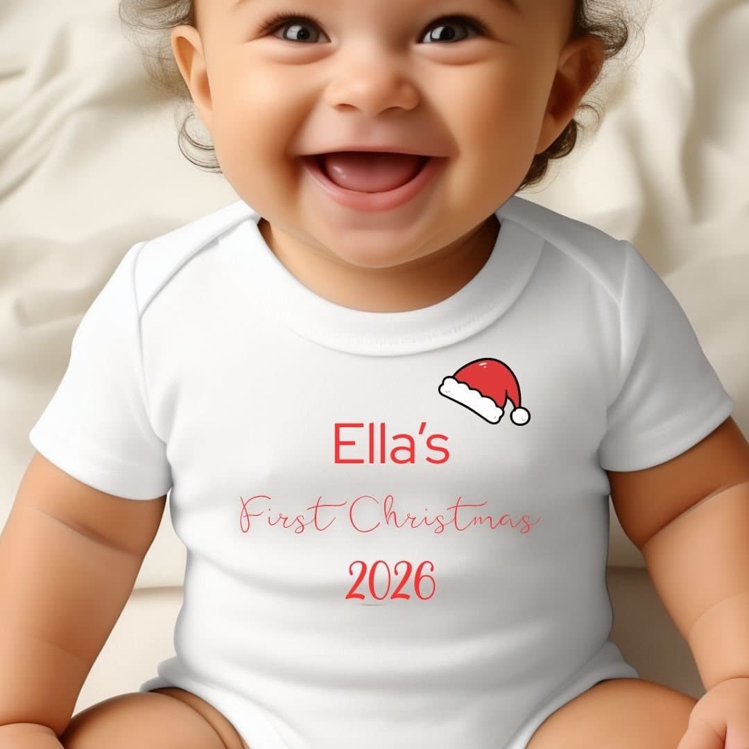 Personalised first Christmas baby grow with a Santa hat design and a name