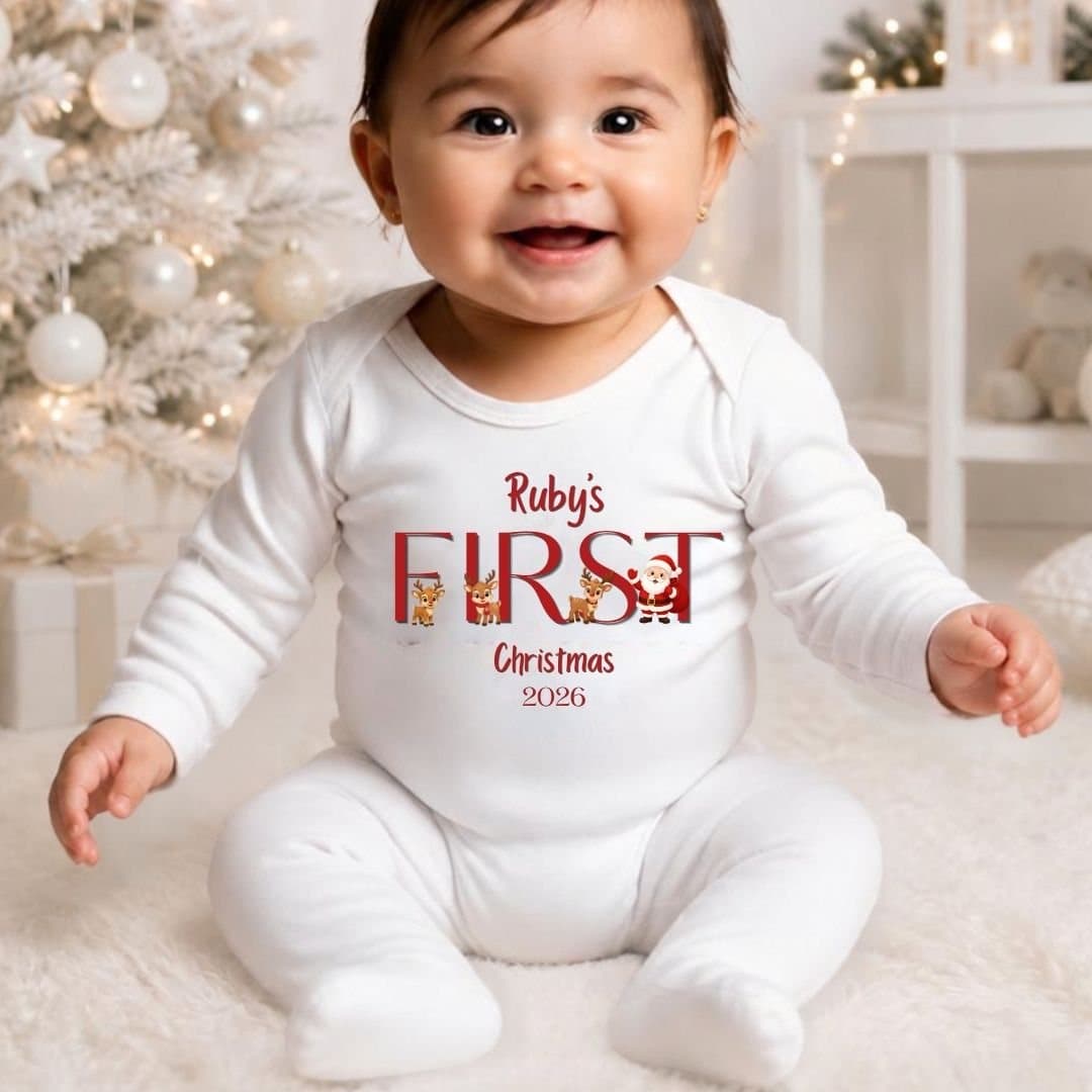 Baby vest with a Santa and reindeers design, personalised with a name