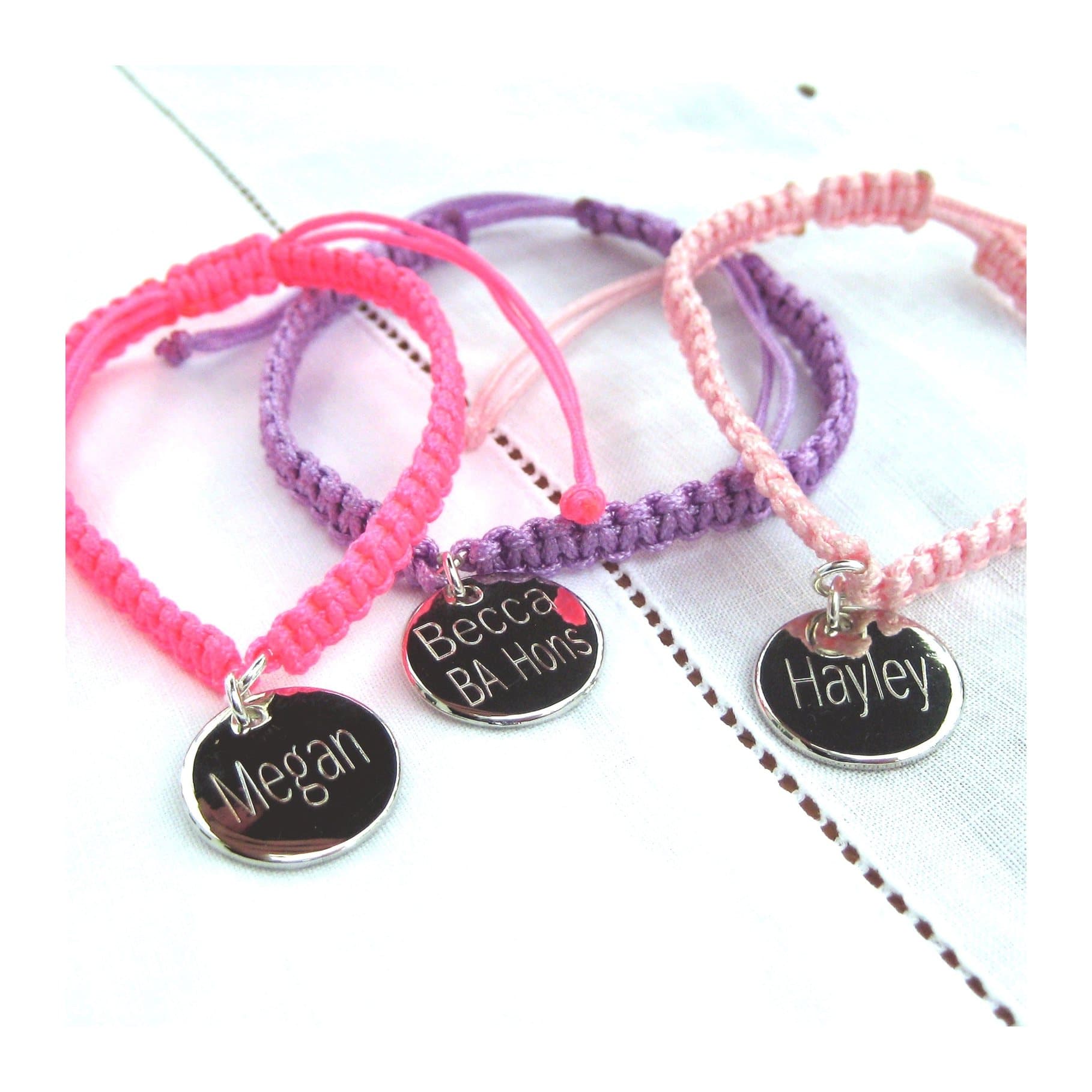 Personalised friendship bracelet on braided nylon cord with an engraved silver disc
