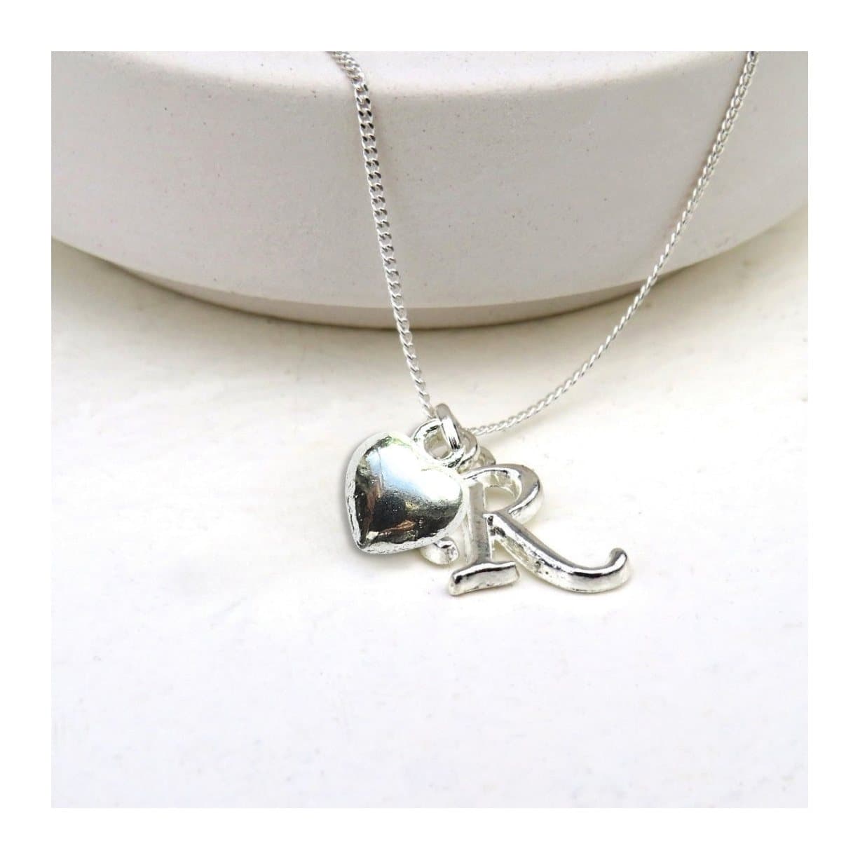 Personalised initial puff heart charm necklace on a silver chain