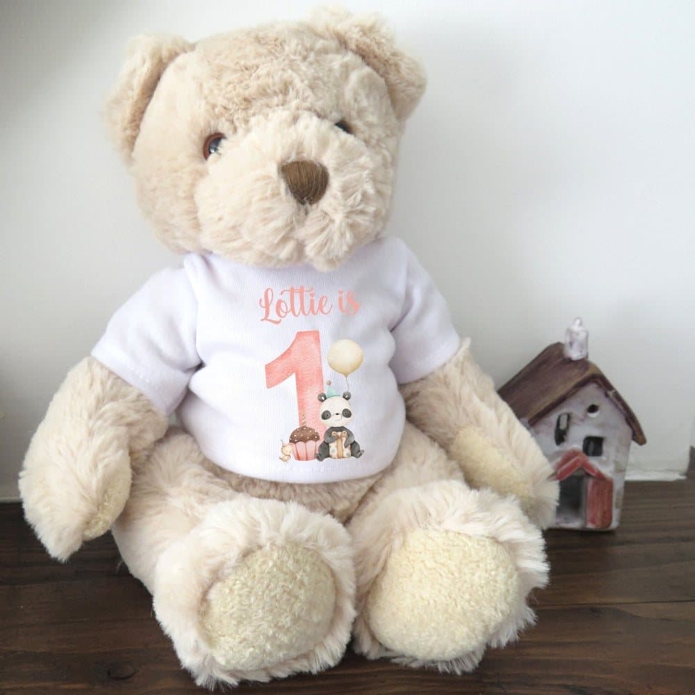 Teddy bear in a printed 1st birthday shirt with a large 1 design