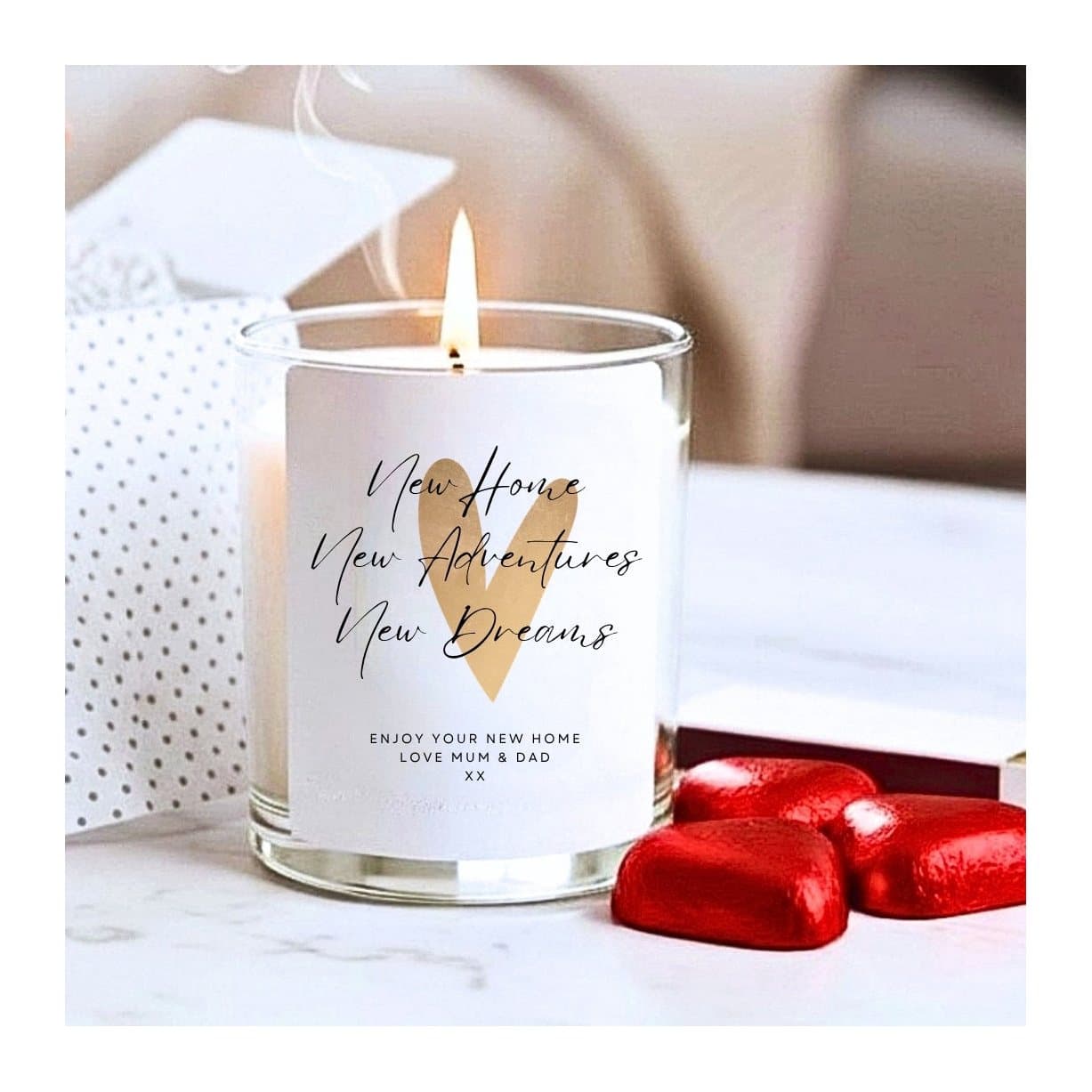 Gold heart new home candle with black lettering, presented in a gift box