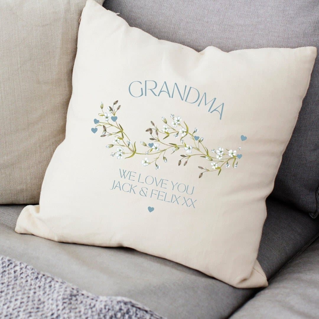 Cream personalised cushion with a blue floral pattern and Grandma message