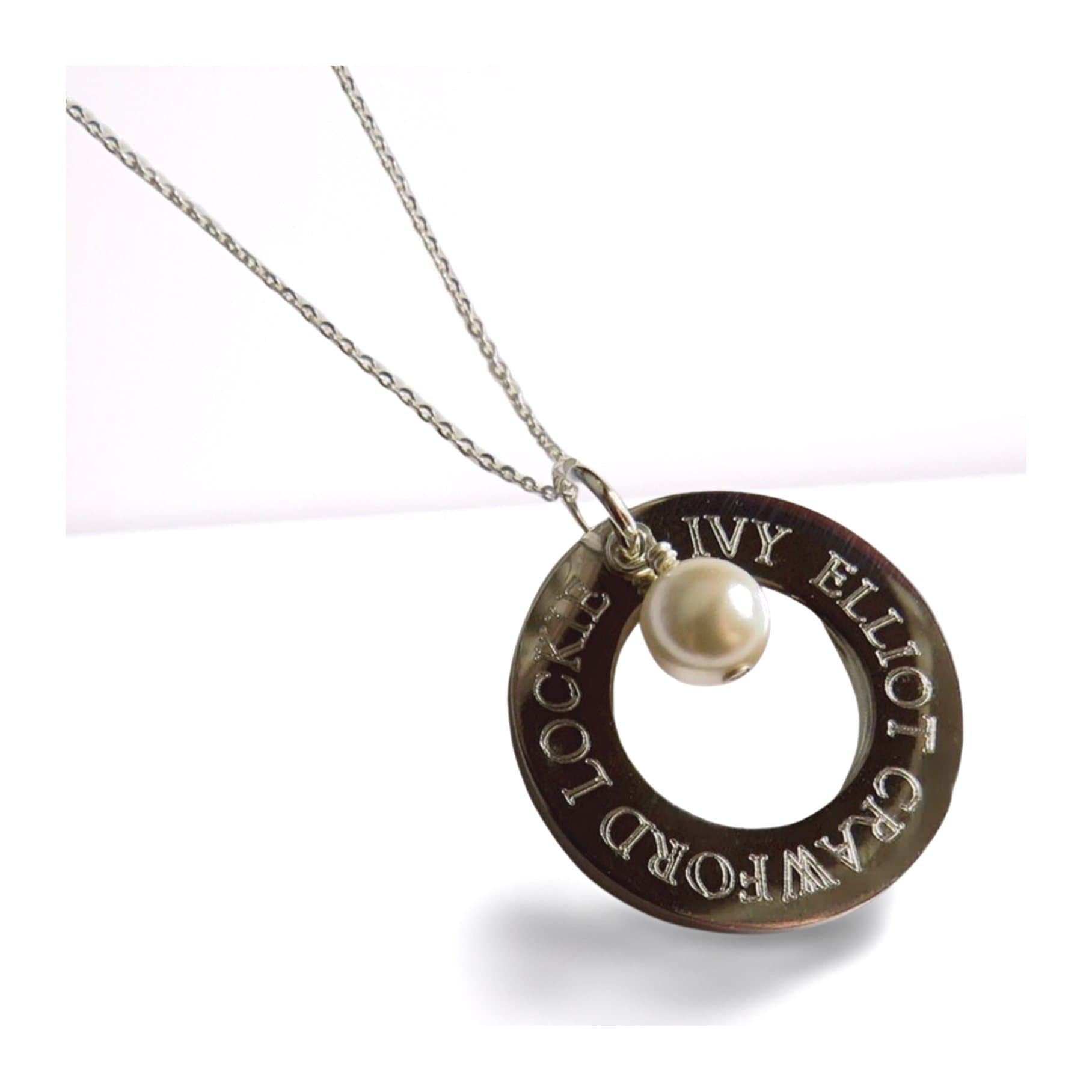 Personalised infinity necklace with a pale ivory pearl and a bright silver disc