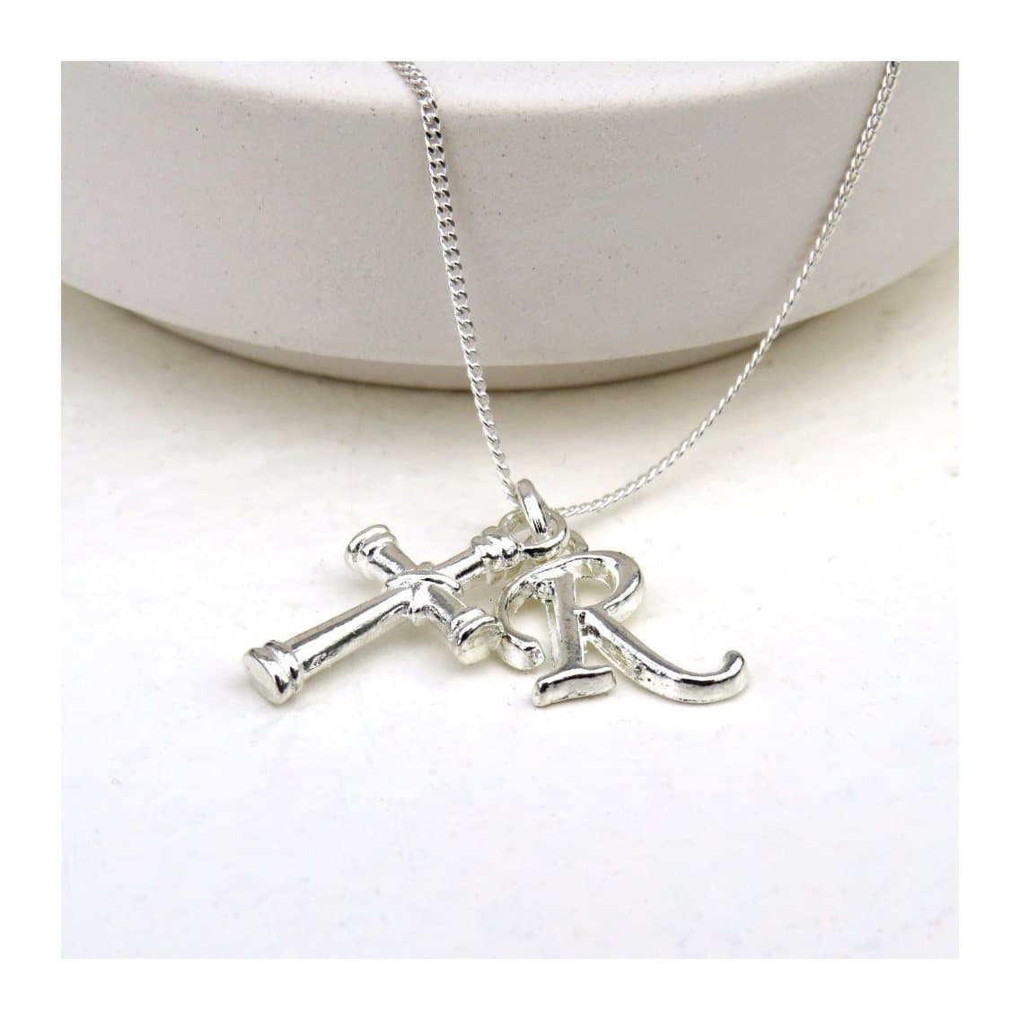 Initial cross charm necklace on a sterling silver chain