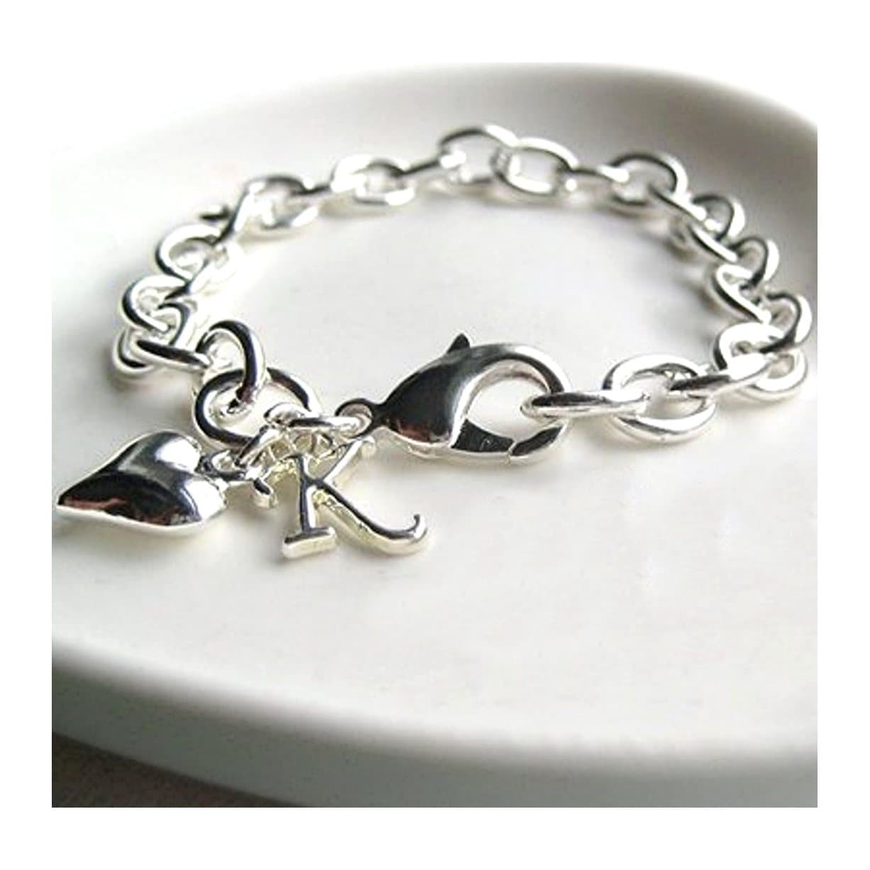 Silver plated cable bracelet with a puff heart charm and a silver initial.