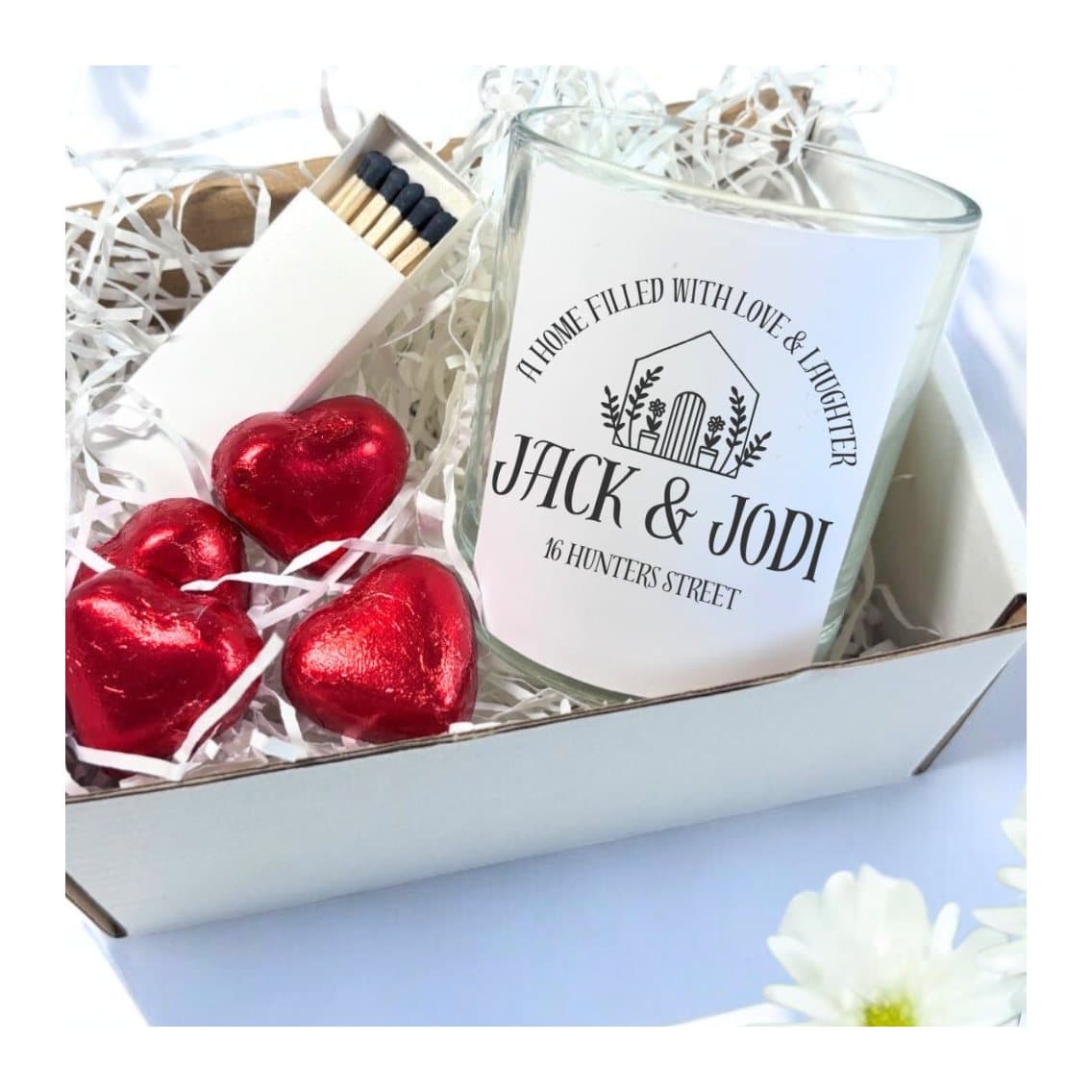 New home candle gift set with a little house and flowers design, chocolates and matches