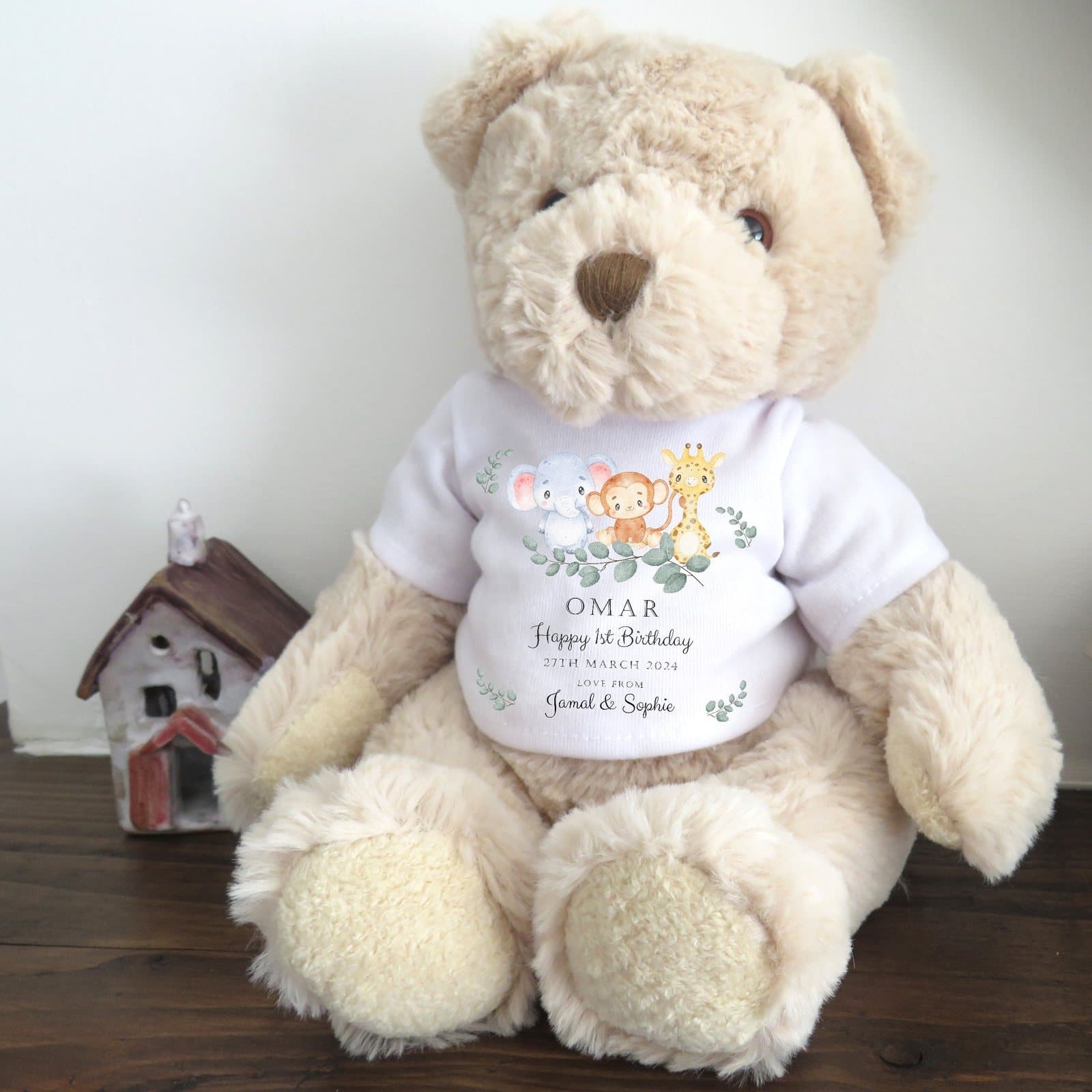 Teddy bear in a T-shirt with an elephant, monkey and giraffe design