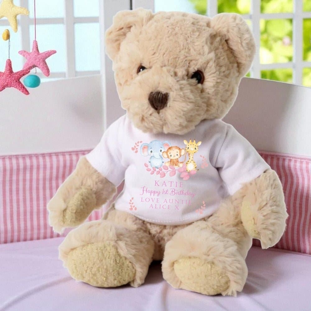 Teddy bear in a printed T-shirt with an elephant, monkey and giraffe design