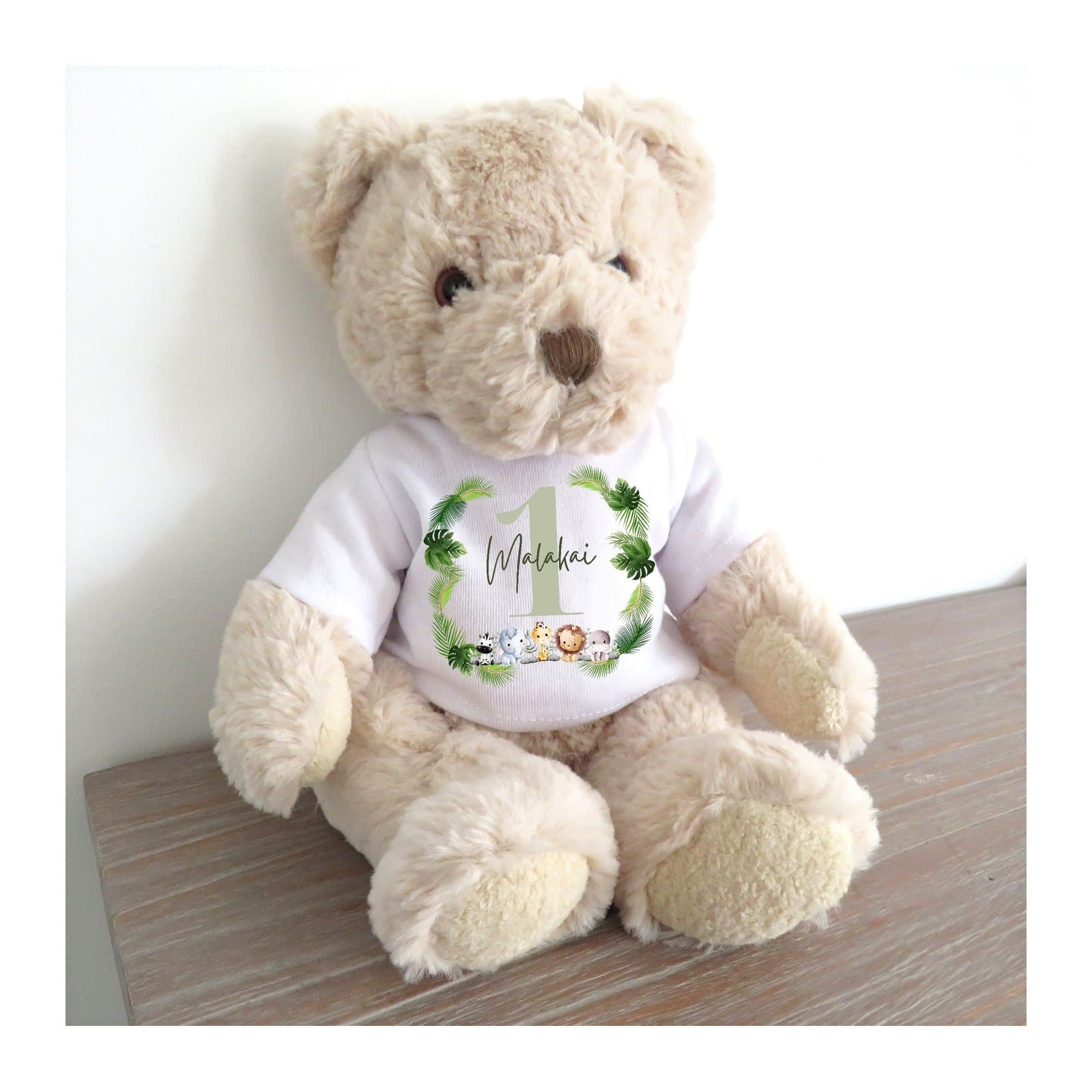 Personalised teddy bear with a printed T-shirt showing five animals and greenery