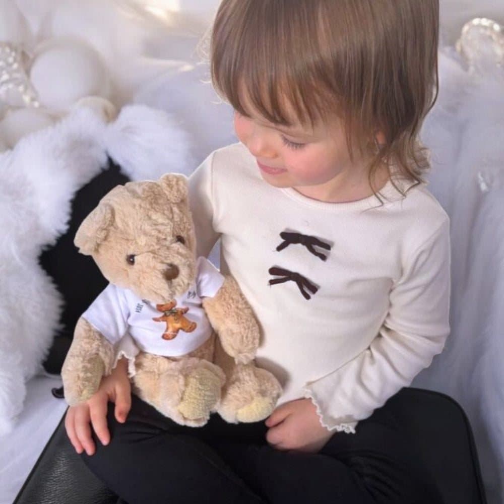 Teddy bear in a T-shirt with a Santa sleigh and reindeer design, First Christmas 2026
