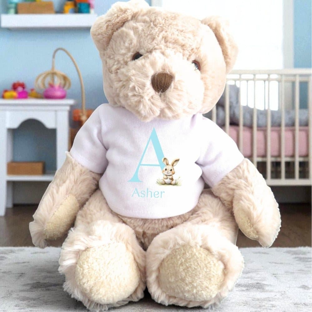 Personalised teddy bear wearing a printed T-shirt with a bunny design and a blue initial