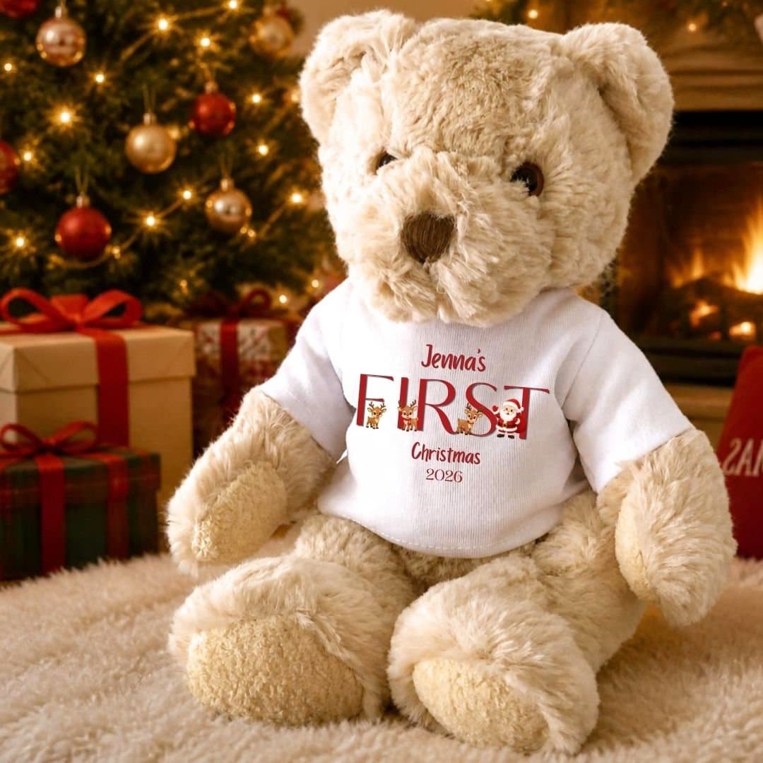 Teddy bear in a Santa team T-shirt with First Christmas 2026 text