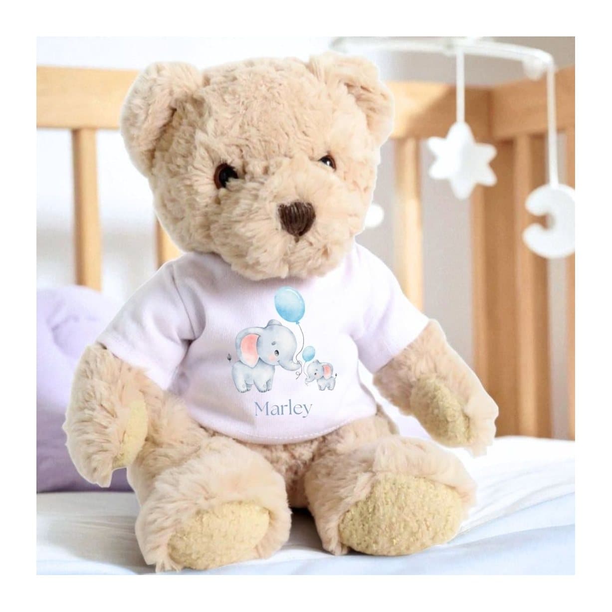 Personalised teddy bear in a T-shirt with two little elephants holding blue balloons