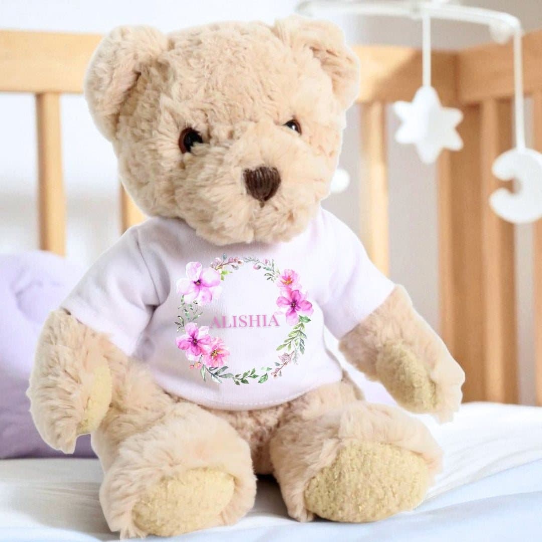 Personalised teddy bear in a printed T-shirt with a pink flower wreath design