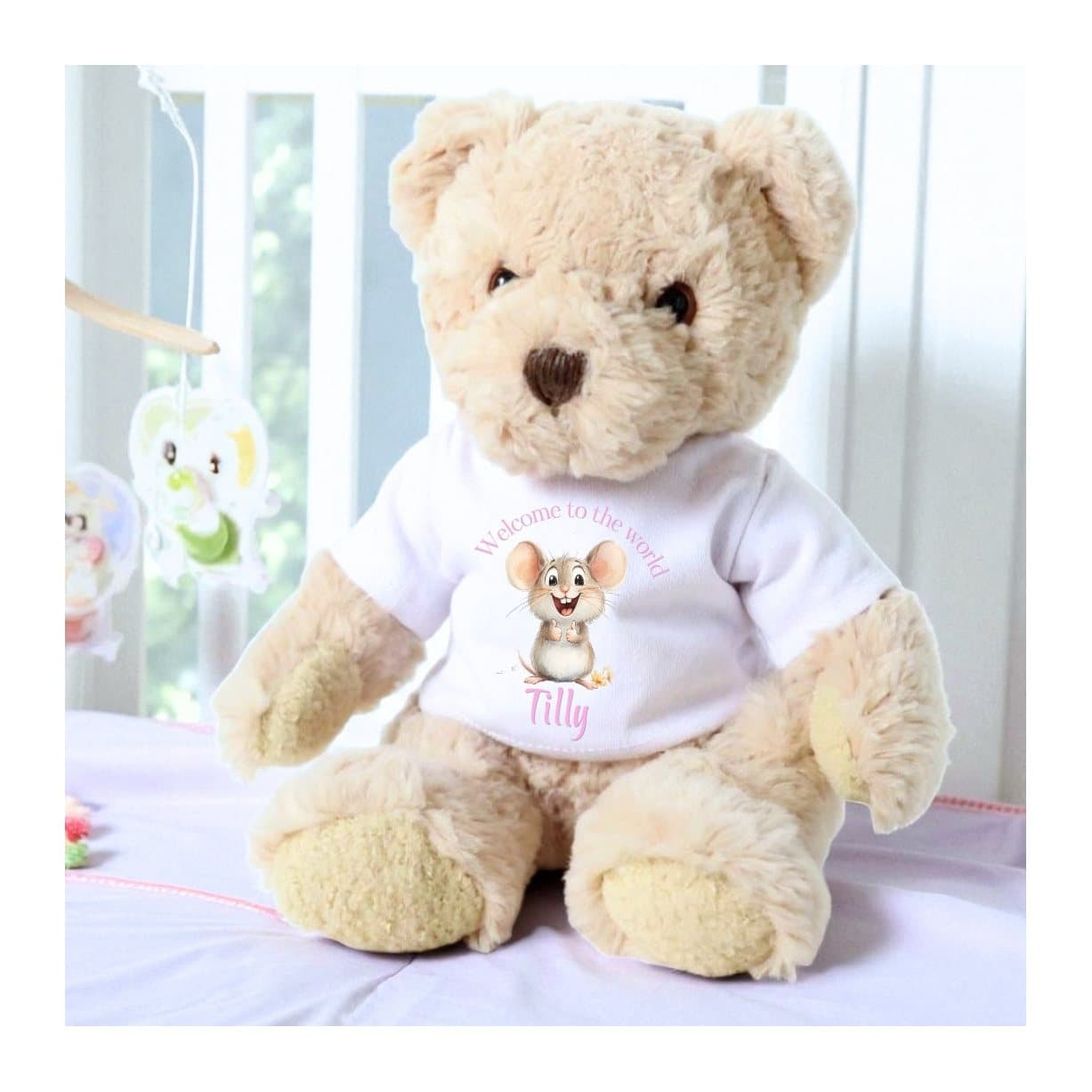 Personalised teddy bear in a T-shirt with a pink mouse and welcome to the world design