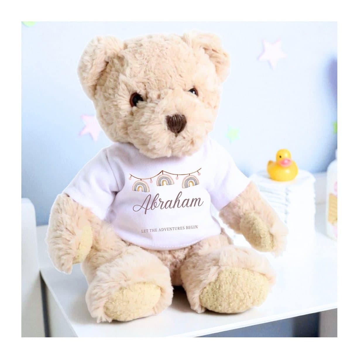 Personalised teddy bear wearing a rainbow bunting T-shirt