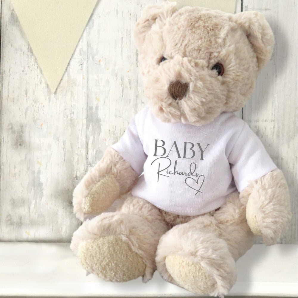 Personalised teddy bear in a printed T-shirt with a surname and a little heart
