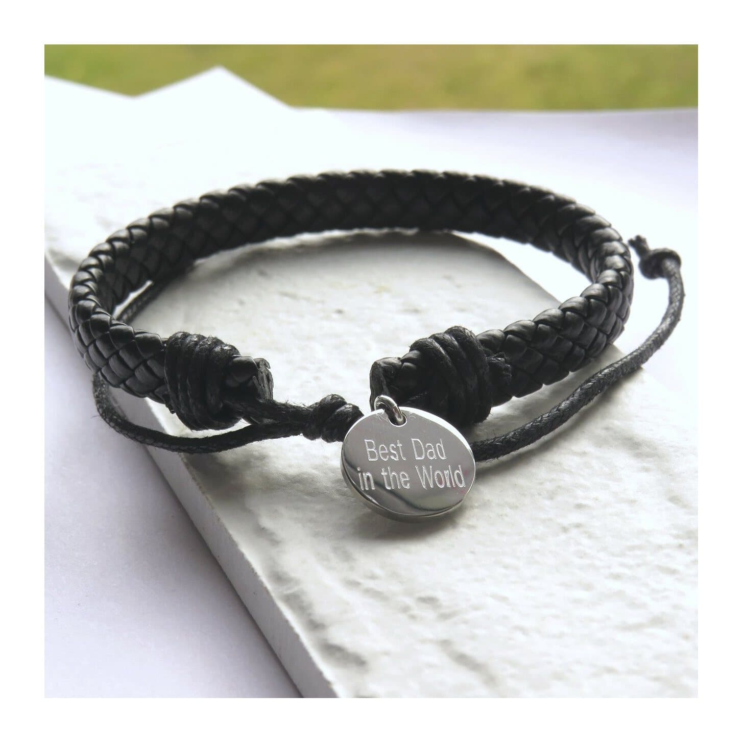 Black imitation leather weave bracelet with a round stainless steel personalisation disc.