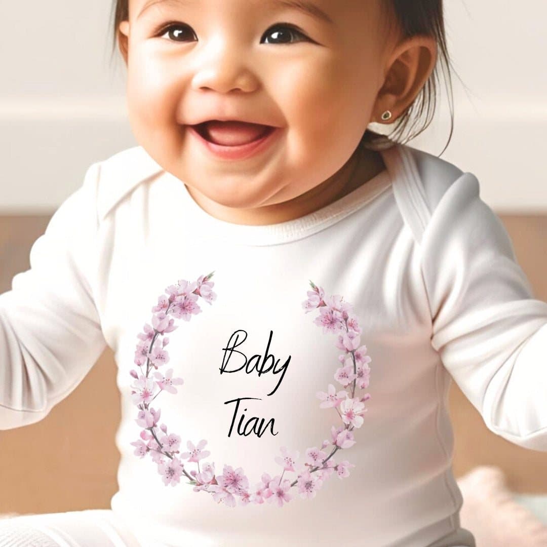 Personalised pink blossom baby grow, vest or bib with a name