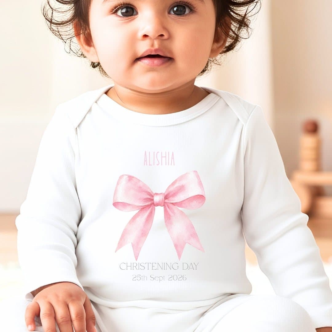 Personalised pink bow christening baby grow, vest or bib with a name