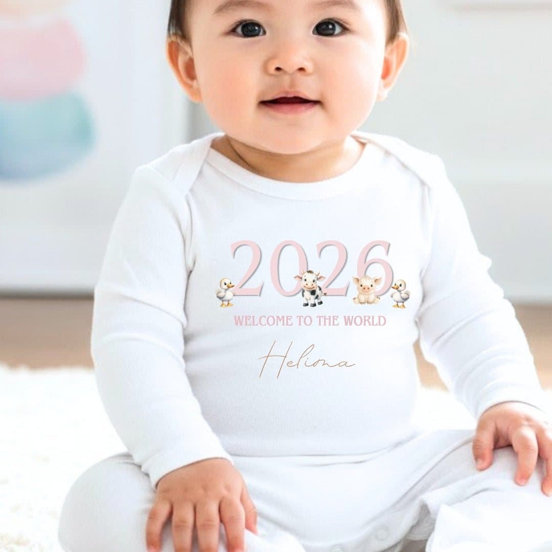 Personalised baby grow with pink farm animals artwork and a name