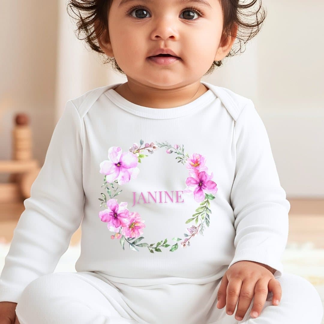 Pink floral wreath baby grow, vest or bib with a name