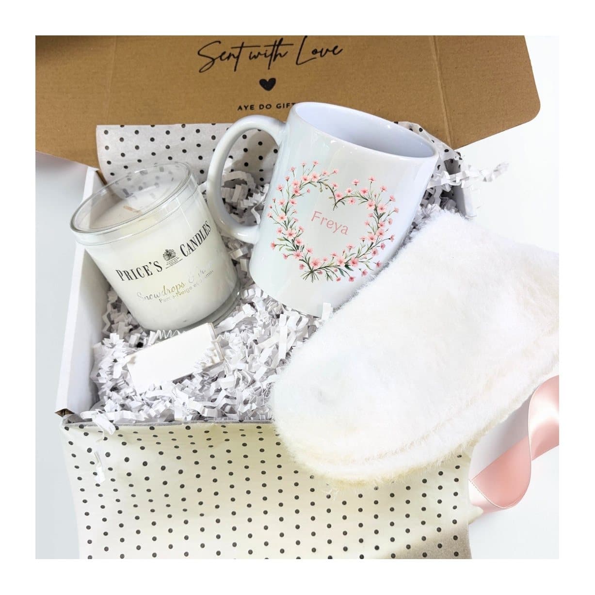 Flower mug with a name, scented candle, fluffy socks and matches in a gift hamper