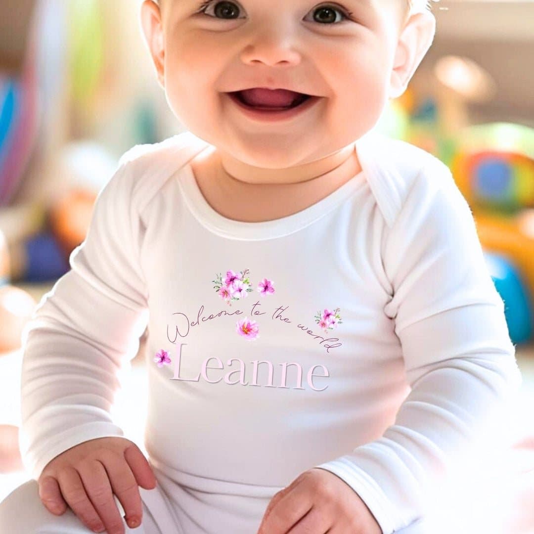 Personalised pink flowers baby grow, vest or bib with a name